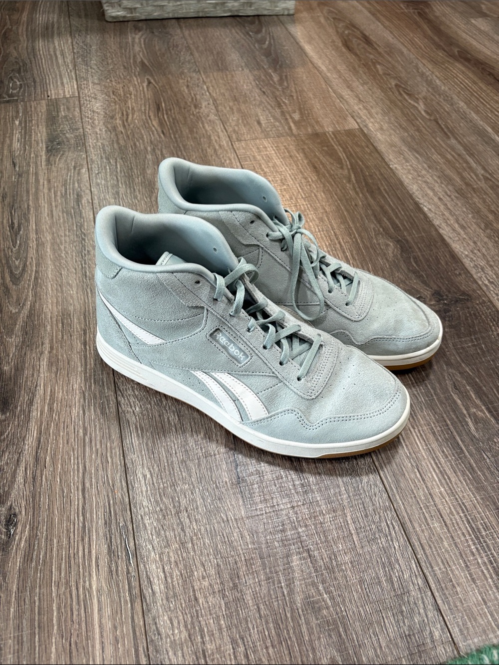 Reebok Women’s Mid-Top Suede Sneakers in mint green and White